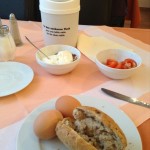 A deluxe assortment of simple foods to start your day off healthily and make you feel like royalty: hard-boiled eggs and bread.