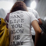 Work hard like you blow me baby...matching shirts exiting the subway.