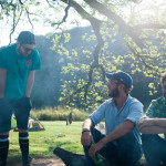 Wise guys sitting around a campfire telling jokes about who knows what.