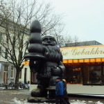 A giant Santa holds an oversized ice-cream cone, ready to share it with a naughty little girl. I mean...Santa is holding a genetically-modified pacifier specifically designed for the fattest well-behaved kid in the universe. I mean...it's a goth kid's melting wax Christmas tree because the Christmas spirit infects even the darkest of goths. Oh wait...it's just a harmless ole butt plug.