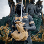 Poseidon ponders what it feels like to have a salty liquid spewed all over his glorious bearded face. Shortly after this shot he didn't have to wonder because the water that went up came back down. If he were truly efficient he would've just asked all the topless chicks behind him....