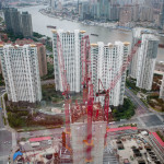 Shanghai Tower under construction, as viewed from the Shanghai World Financial Center. The Pudong River runs in the background.