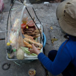 Pipi got a banh mi from this woman sitting in the street. I think the woman asked me if I want one and I didn't want one but I didn't want to tell her no and then I became socially uncomfortable and said yes, please give me a sandwich. It was like $0.50 or something...whatever.