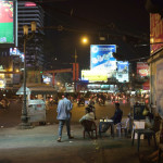 Typical zombiesque walk through the city, lit courtesy of advertisers who want to sell you 1) beer, 2) cheap plastic chairs, or 3) a motorcycle, the three most common objects in Vietnam.