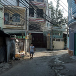 A little boy in plaid shorts comes to greet us and tell us there is ample electricity in Saigon due to all of the wires neatly-arranged over our heads.