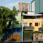 A piece of stemless, jaundiced broccoli slowly usurps the building across from our hotel.