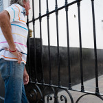 Grandpa waits by the fence for his granddaughter but really he's just chasin' young skirts. His granddaughter died when he was still a child. That cactus sure is growing quickly...