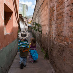 My tour guides showing me around some secret alleys in the city.